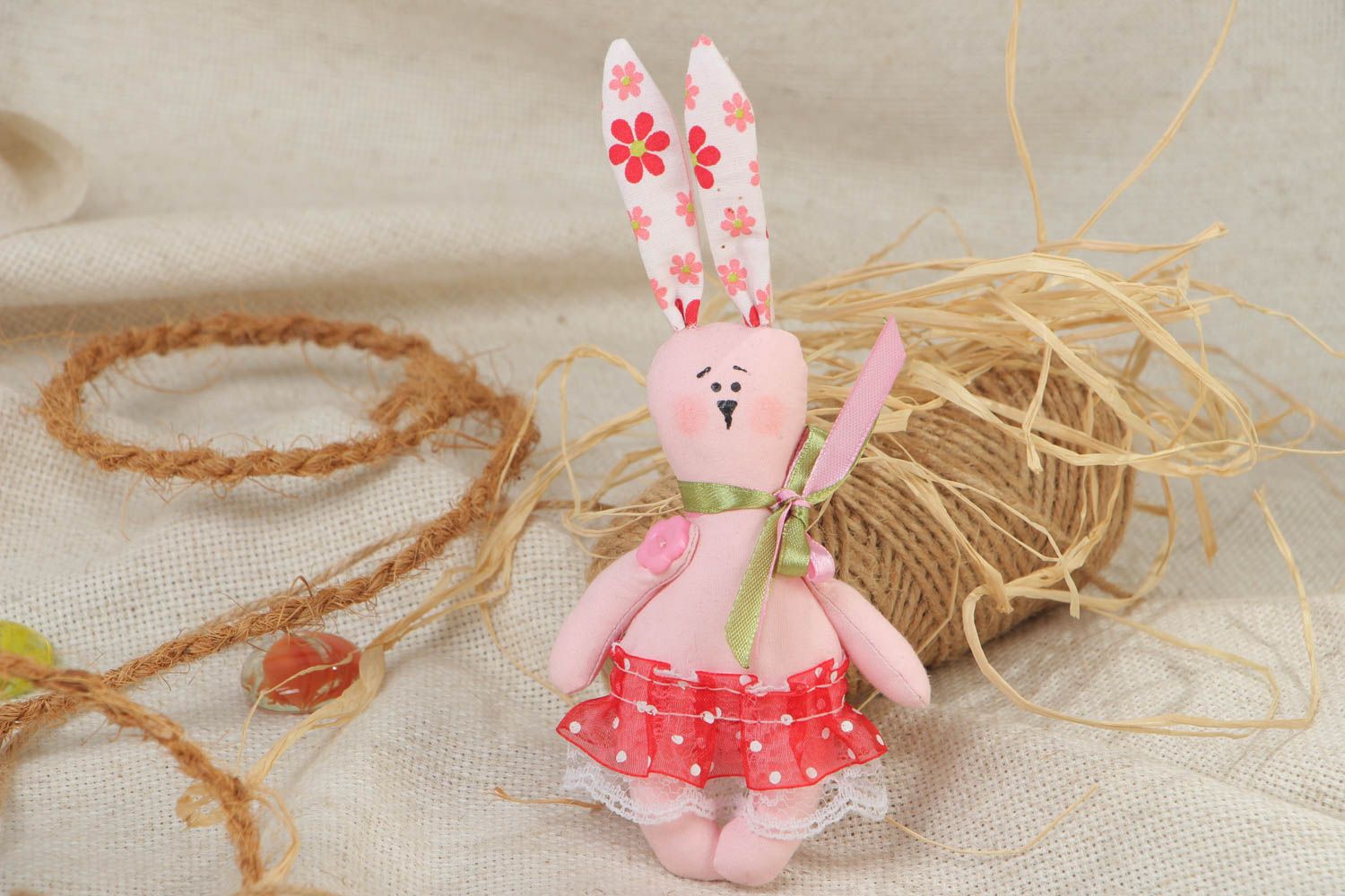 Handmade small soft toy sewn of cotton fabric in the shape of long eared rabbit photo 1