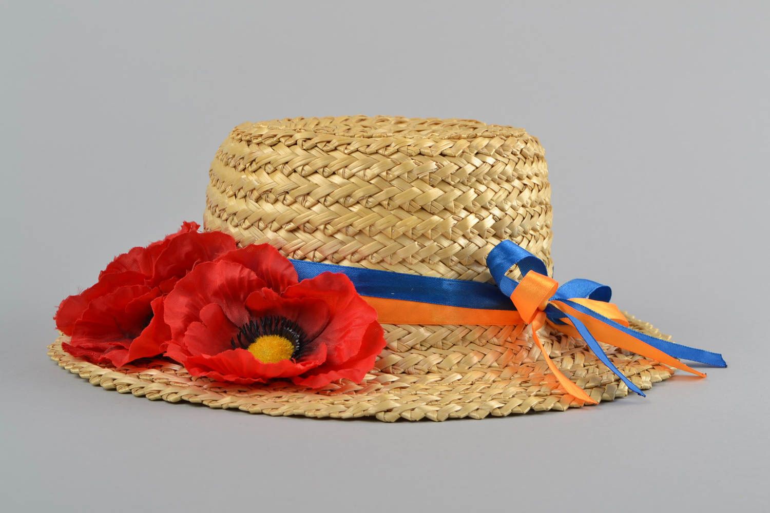 Handmade designer summer straw hat with artificial red flowers and ribbons photo 3