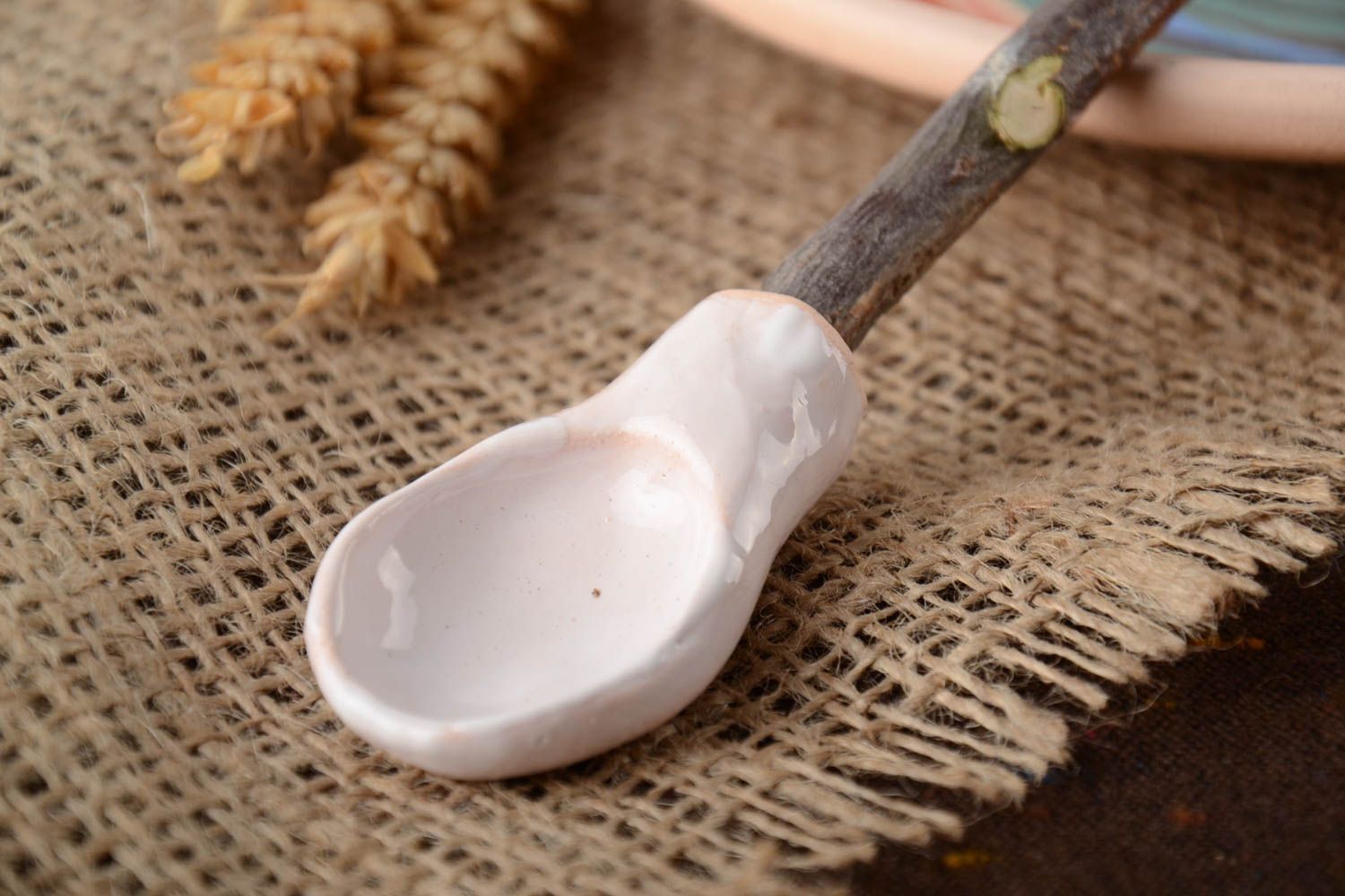 Beautiful handmade white clay spoon with apricot wood handle photo 1