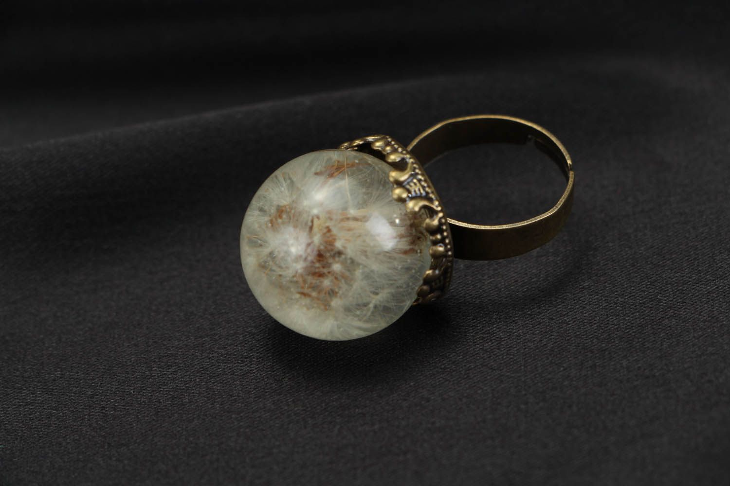 Ring with a natural dandelion coated with jewelry resin photo 4