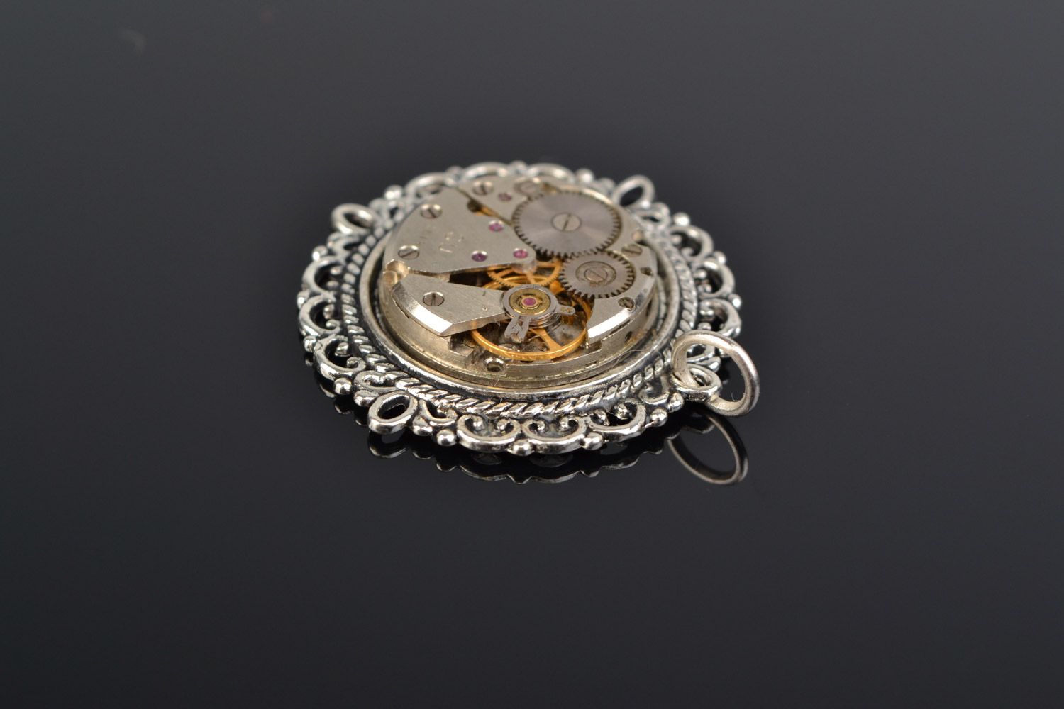 Handmade metal steampunk neck pendant of round shape with clock mechanism  photo 1