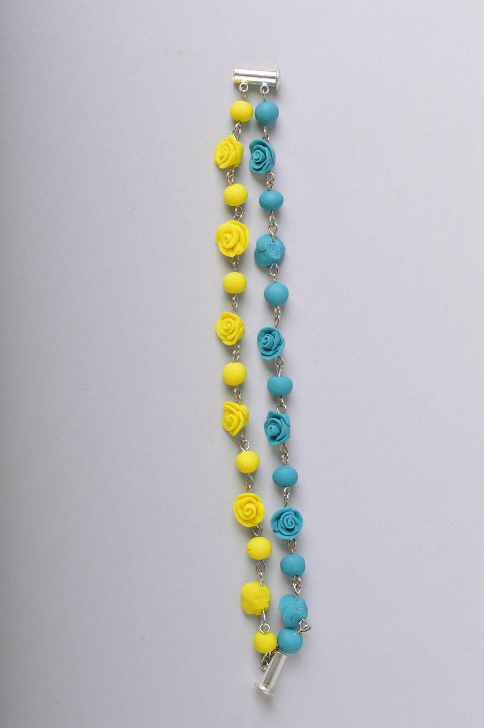 Handmade bright wrist bracelet with blue and yellow cold porcelain rose flowers photo 3