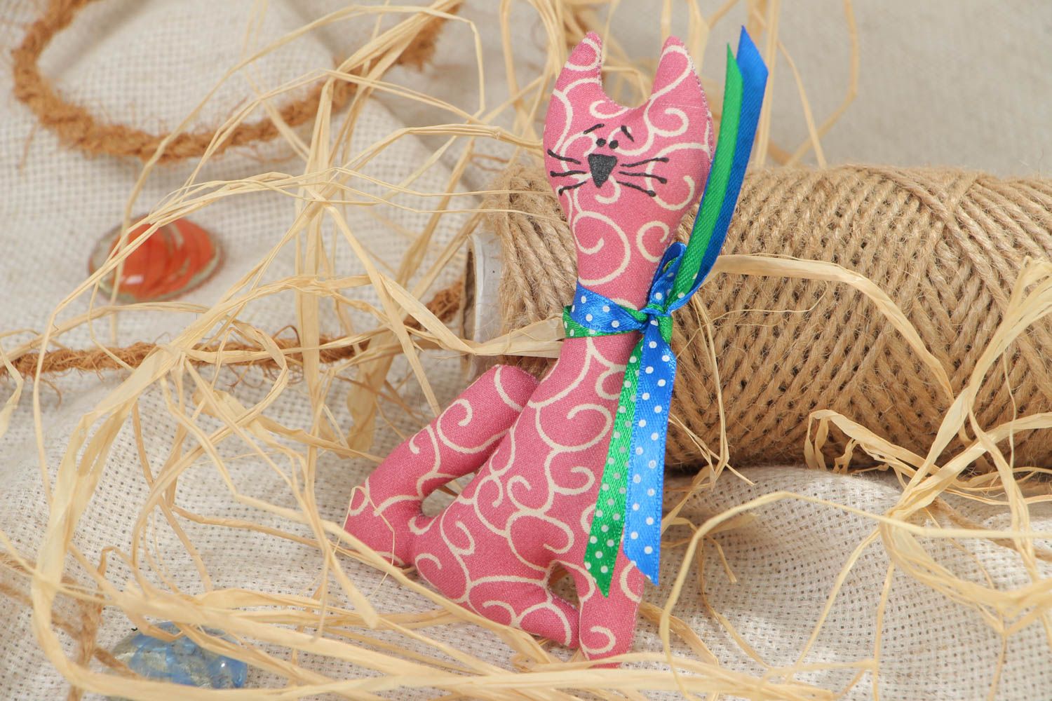 Handmade soft toy fridge magnet sewn of cotton fabric in the shape of pink cat photo 1