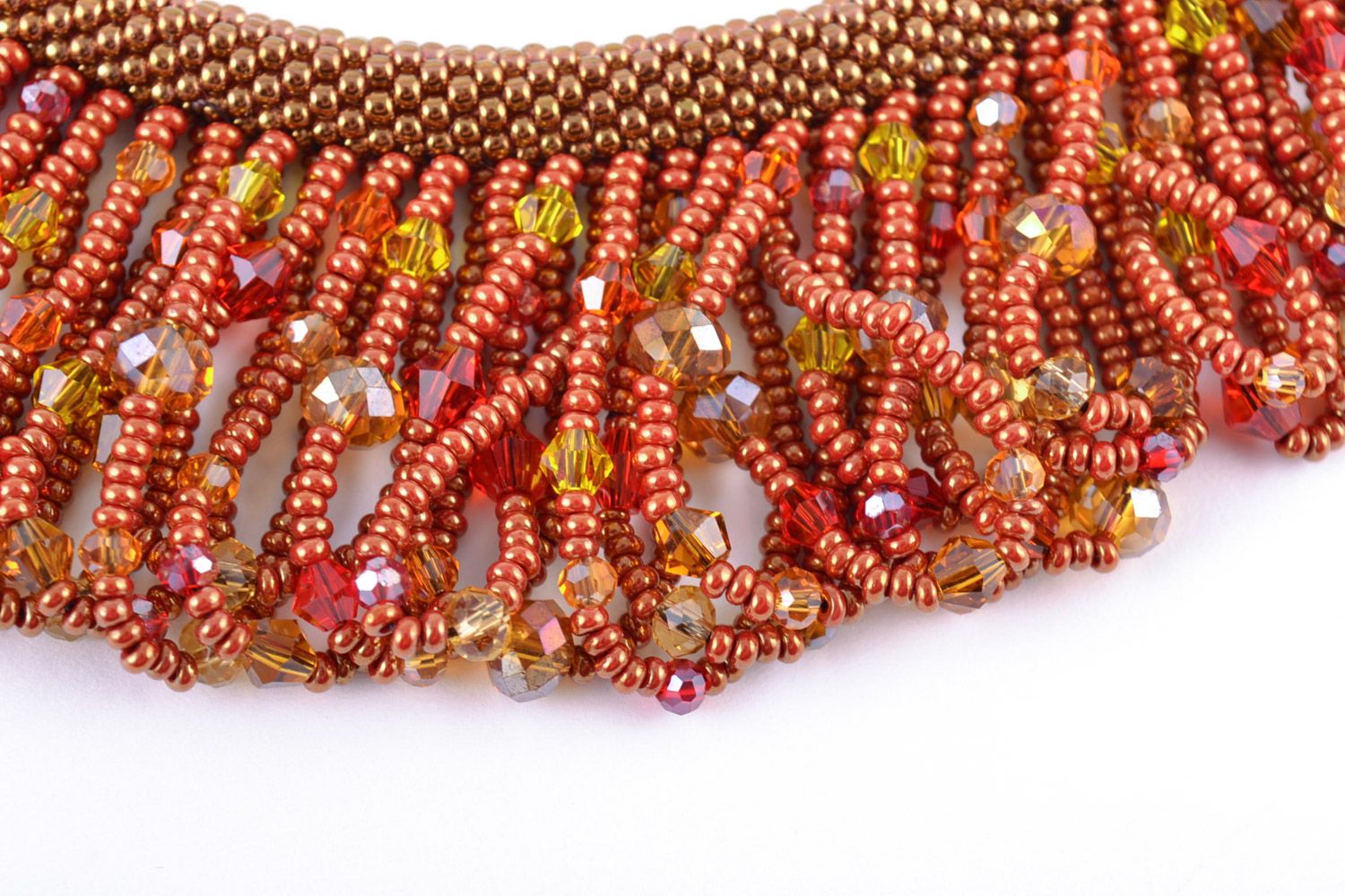 Massive handmade necklace woven of beads with fringe in warm color palette photo 3