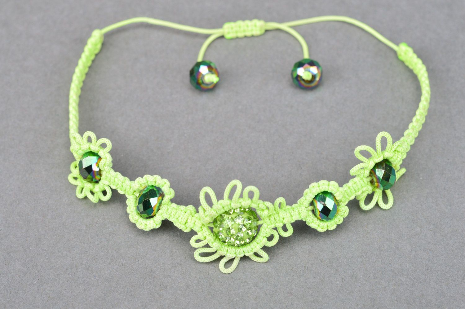 Stylish handmade women's wrist bracelet woven of threads and beads of lime color photo 5