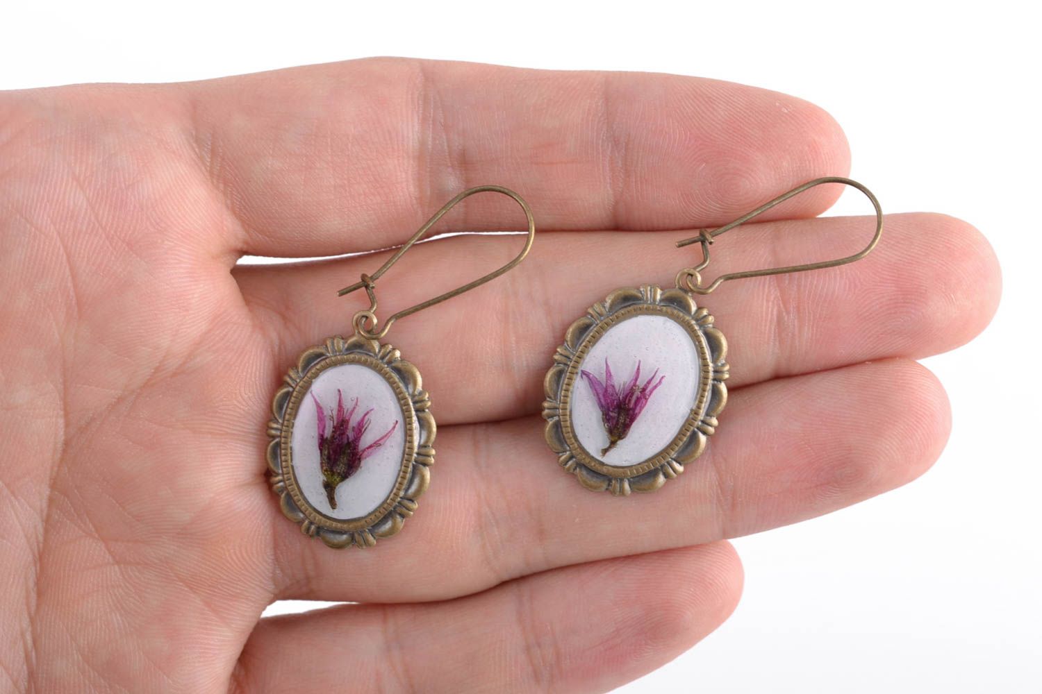 Oval earrings with real flowers coated with epoxy photo 2