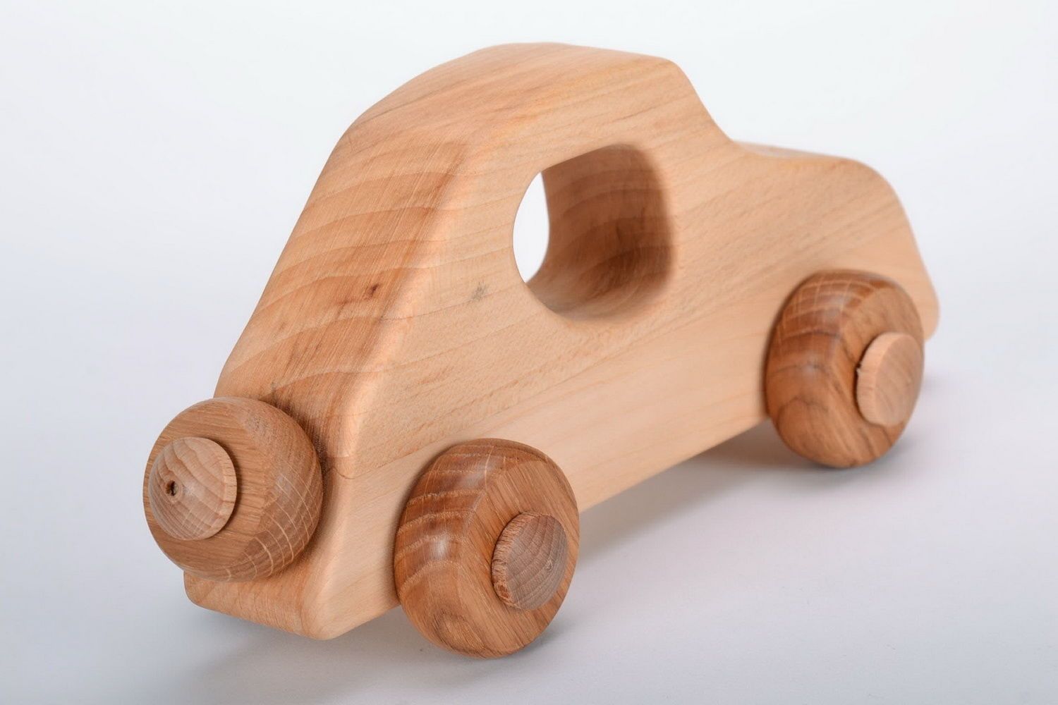 Wooden toy on wheels Car photo 2