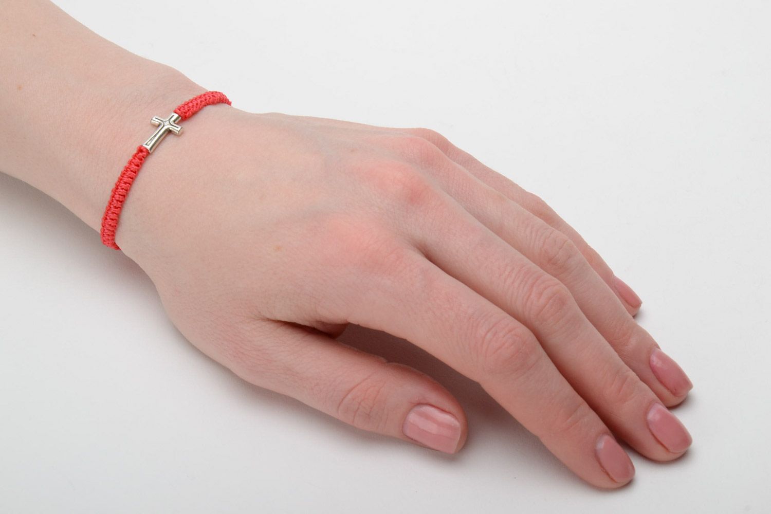 Handmade red friendship wrist bracelet woven of threads with metal cross photo 2