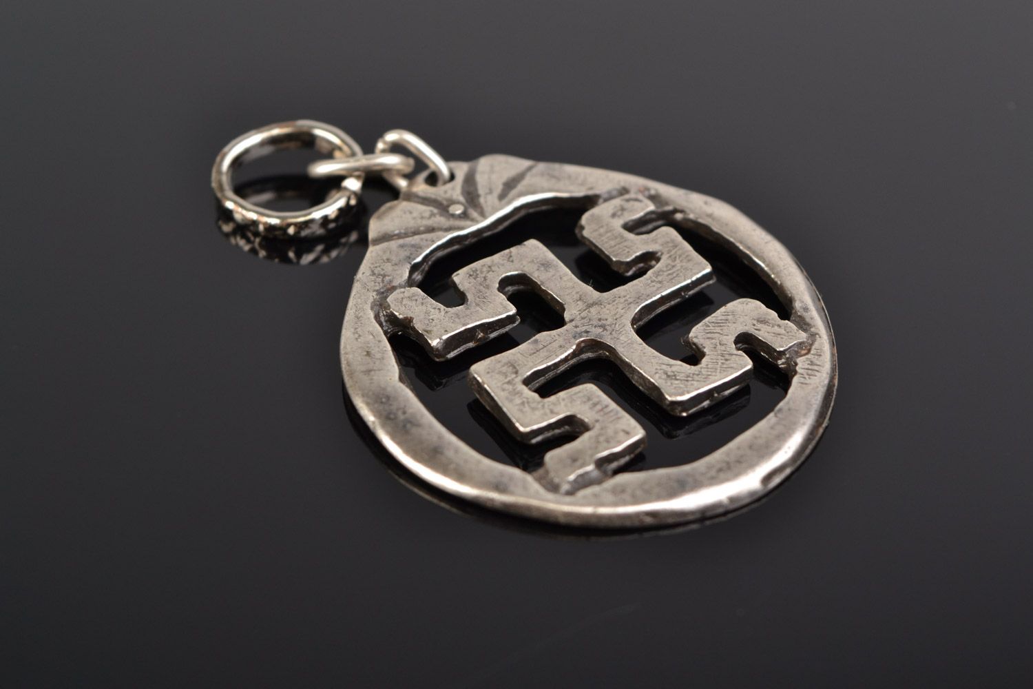 Handmade designer round metal pendant with Slavic symbol in ethnic style  photo 1