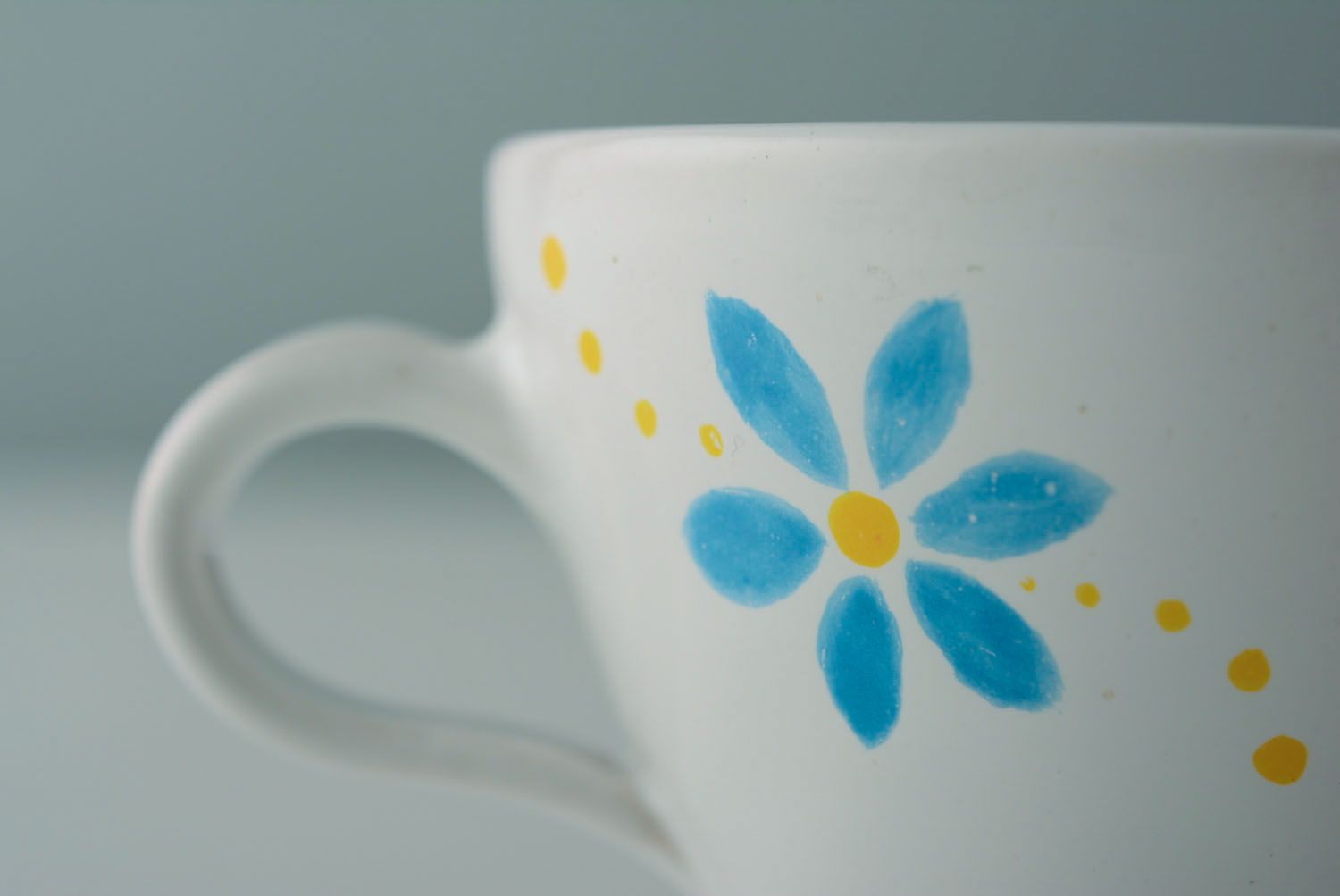 White ceramic drinking handmade 5 oz cup with handle and orange-blue flowers' pattern photo 4