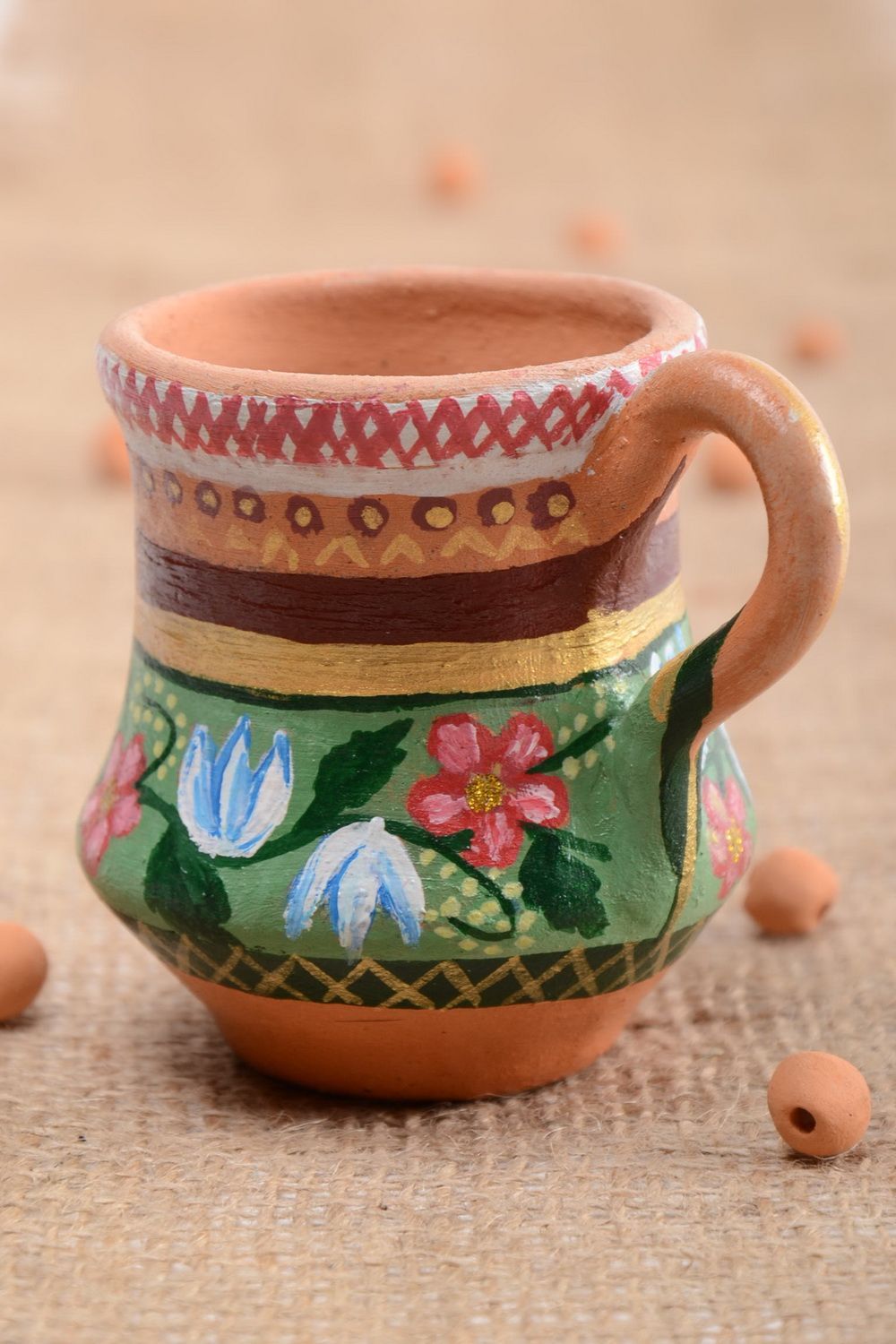 Ceramic glazed drinking cup in the shape of a pitcher with a handle photo 1