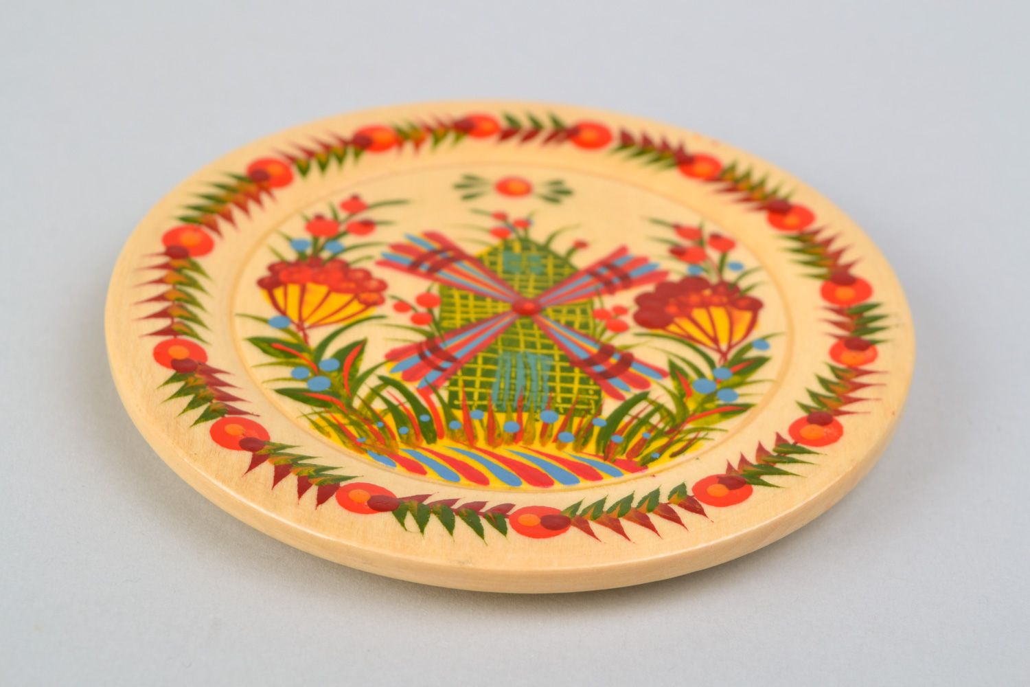 Handmade decorative carved wooden plate with traditional Petrikivka painting photo 3