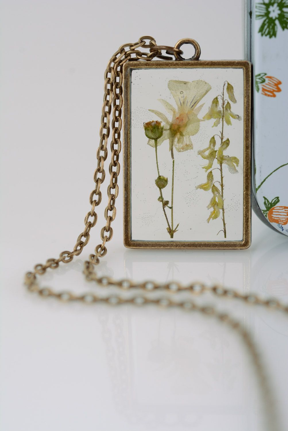 Light handmade rectangular transparent pendant with herbary in epoxy resin  photo 3