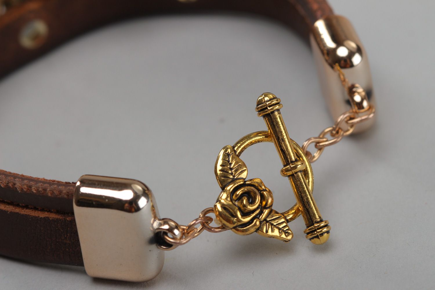 Handmade women's genuine leather bracelet with metal charm in the shape of clover photo 4