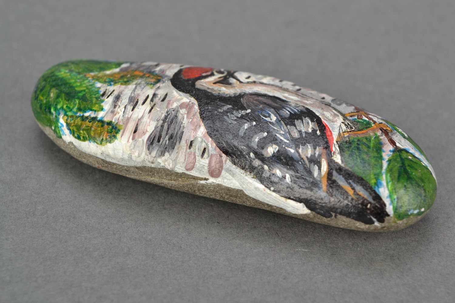 Painted sea stone for decor Woodpecker photo 4