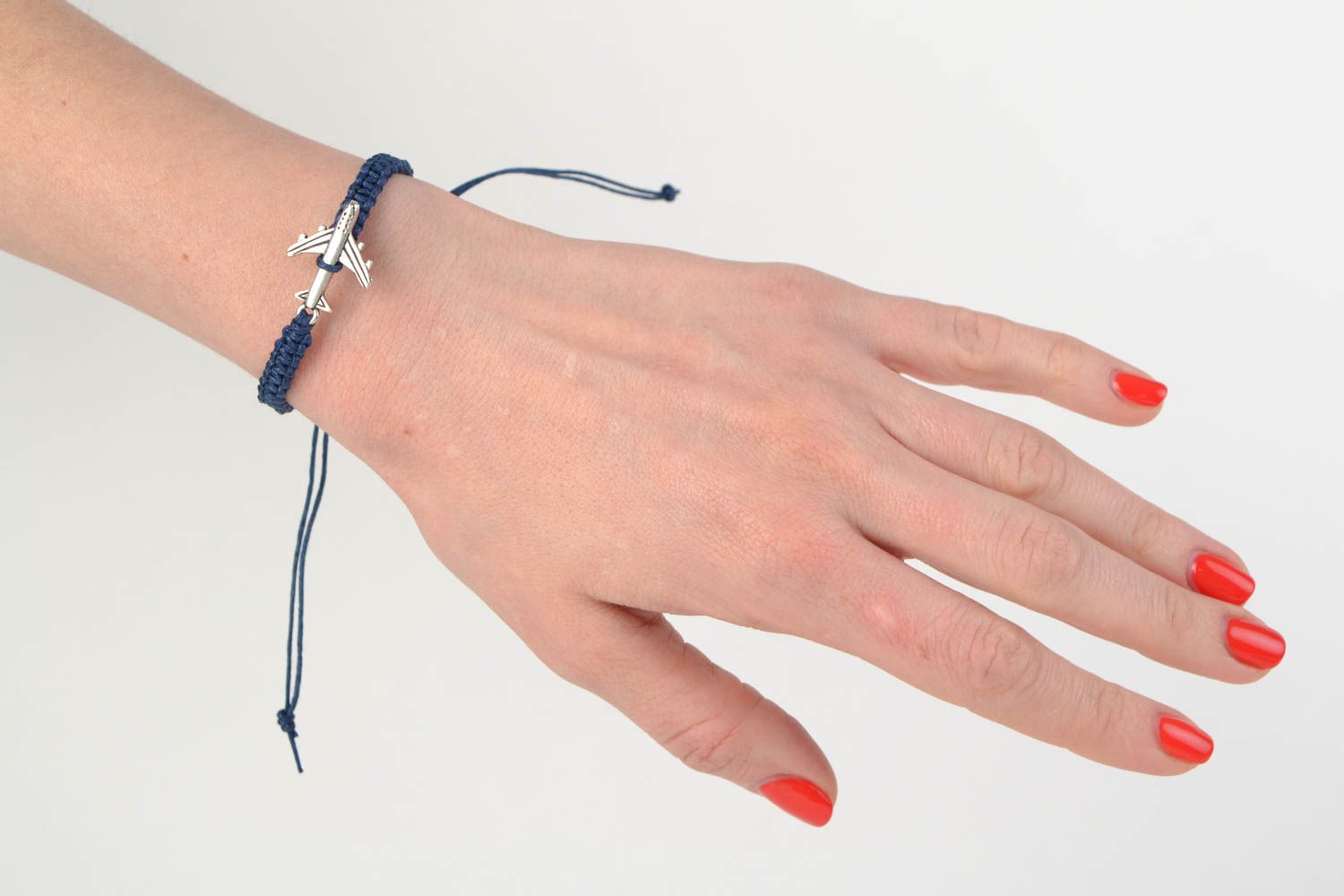 Handmade thin dark blue cotton thread wrist friendship bracelet with metal plane  photo 2