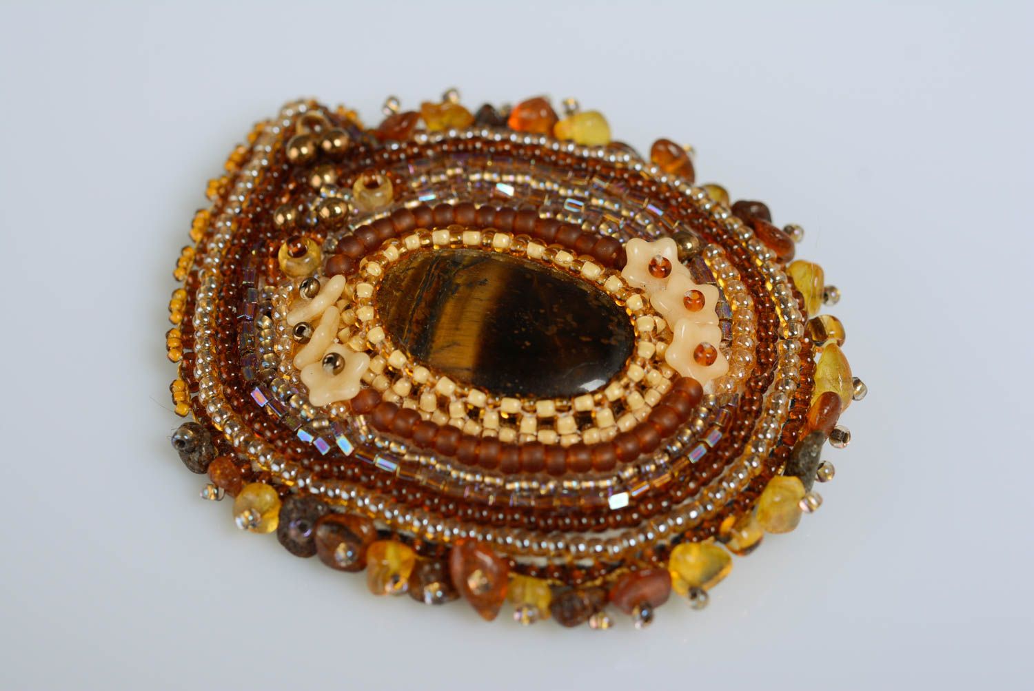 Handmade brown bead embroidered brooch on leather basis with tiger's eye stone photo 1