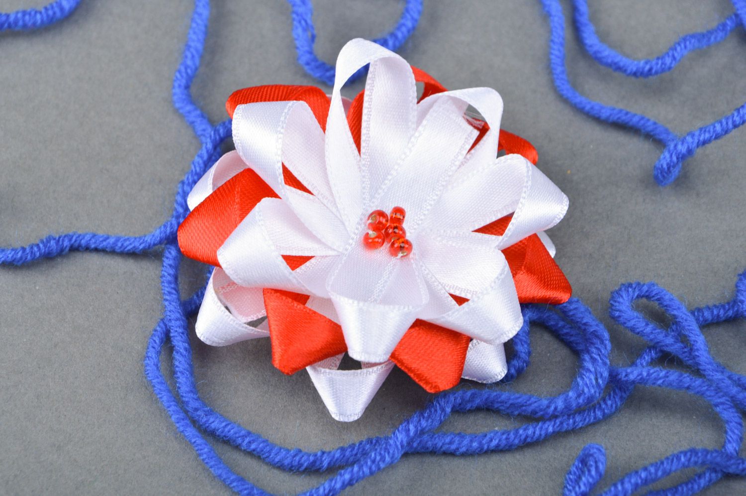 Handmade decorative hair tie with flower sewn of red and white satin ribbons  photo 1