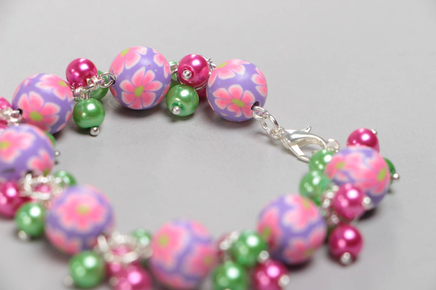 Handmade children's wrist bracelet with polymer clay beads and ceramic pearls photo 4