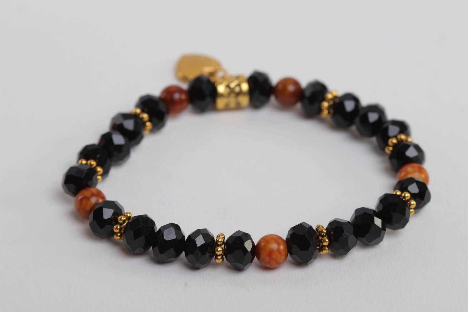 Stretchy beaded  black and cherry beads  gemstone bracelet with heart shape centerpiece photo 4