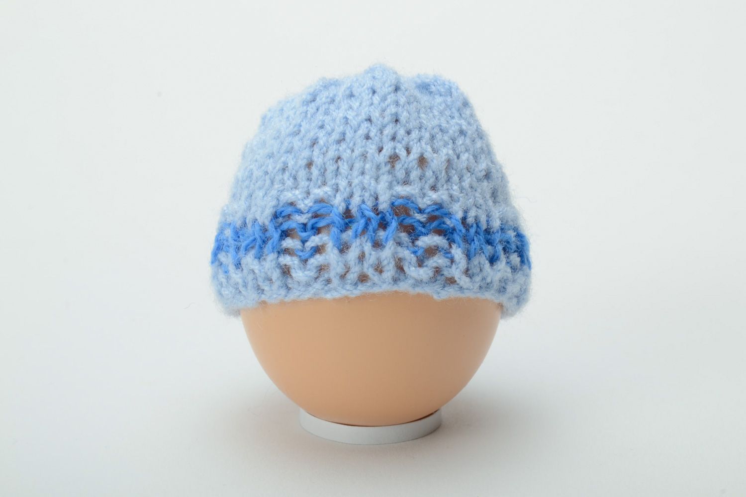 Homemade blue knitted Easter egg cozy photo 2