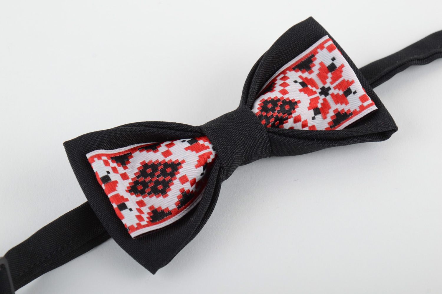 Handmade bow tie sewn of black and ornamented costume fabric in ethnic style photo 4