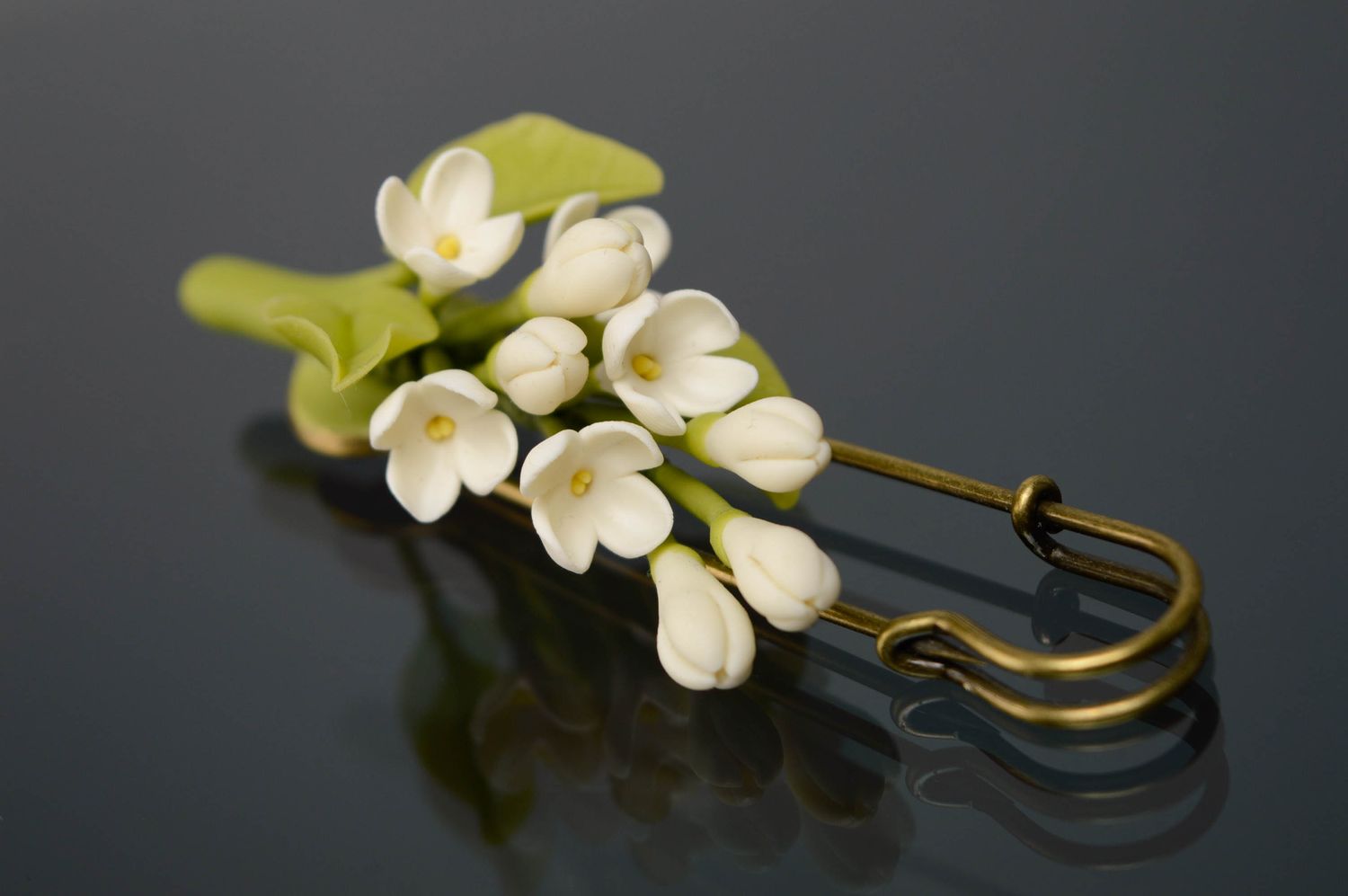 Metal brooch with cold porcelain flowers photo 1