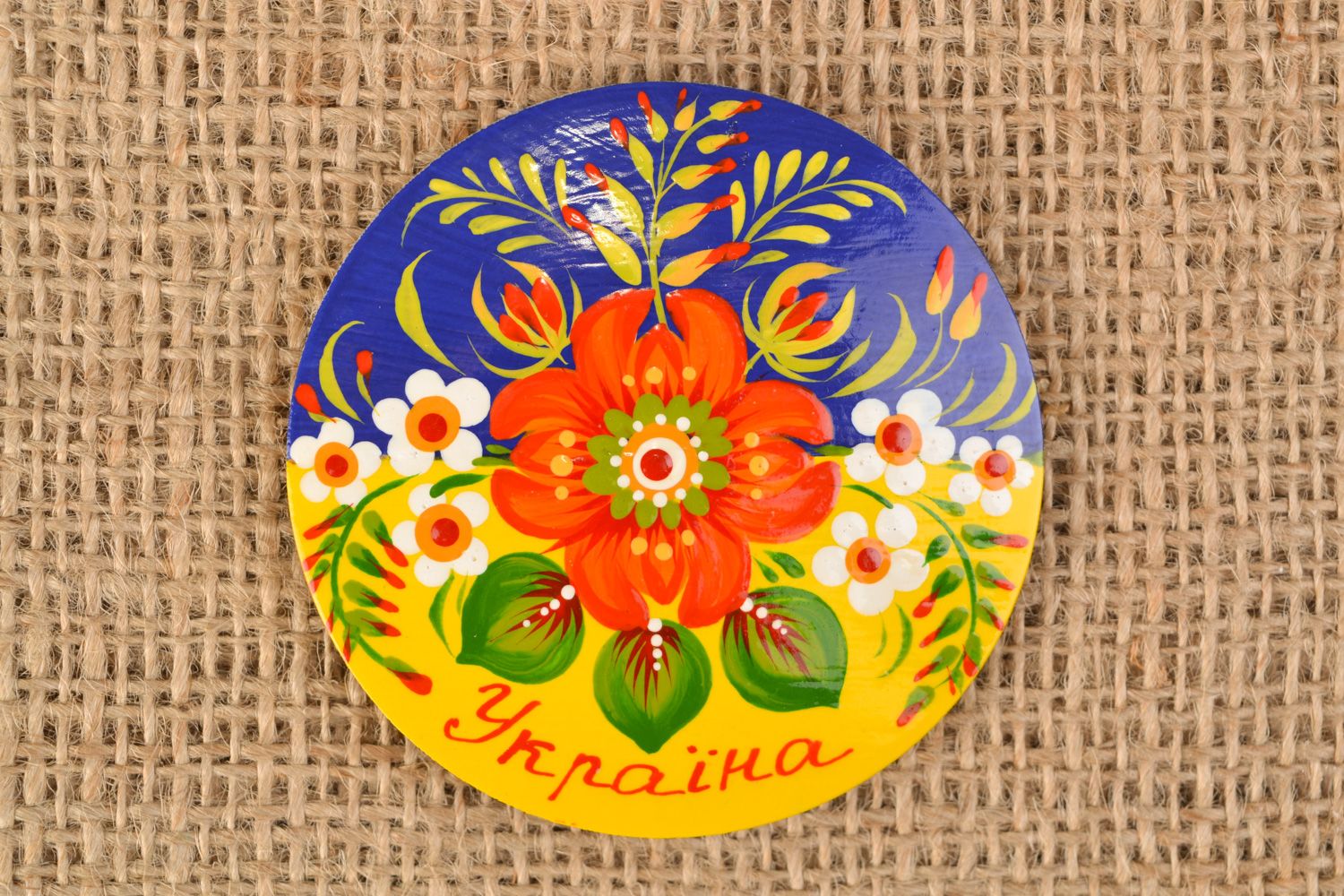 Handmade painted wooden souvenir fridge magnet of round shape in Ukrainian style photo 1