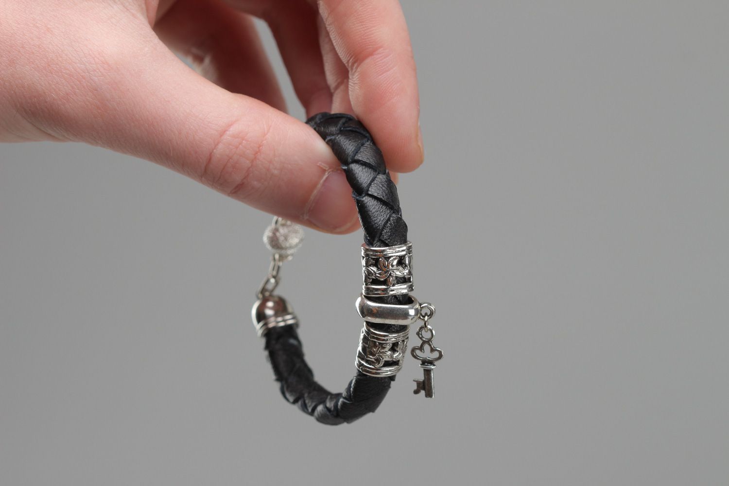 Thin handmade genuine leather bracelet with metal angel charm and magnet lock photo 4
