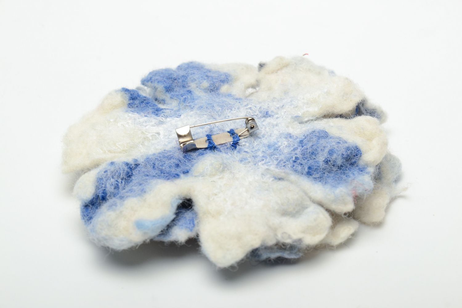 Felted wool brooch in the shape of white and blue flower photo 5