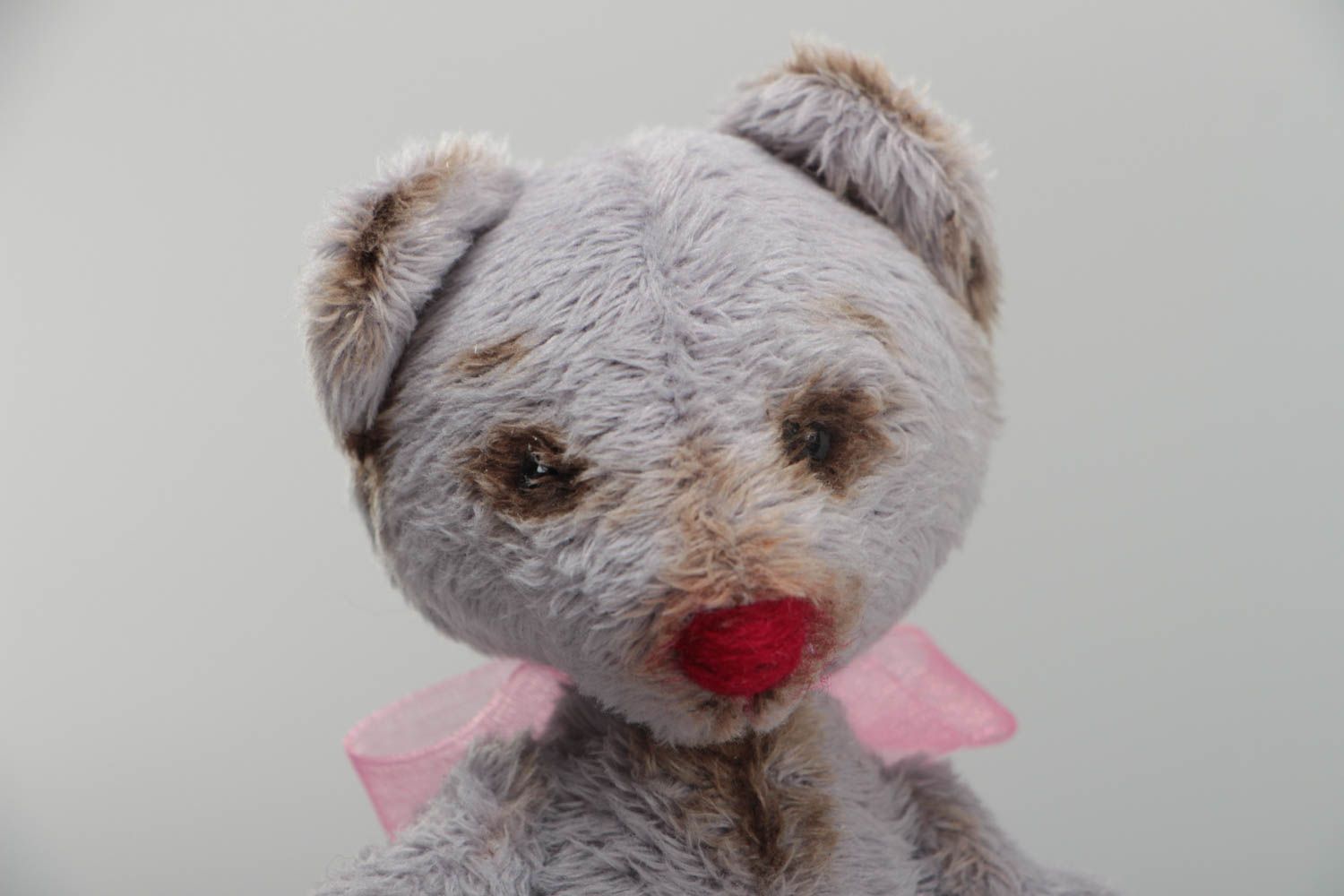 Handmade small faux fur soft toy bear of gray color with pink bow for children photo 3