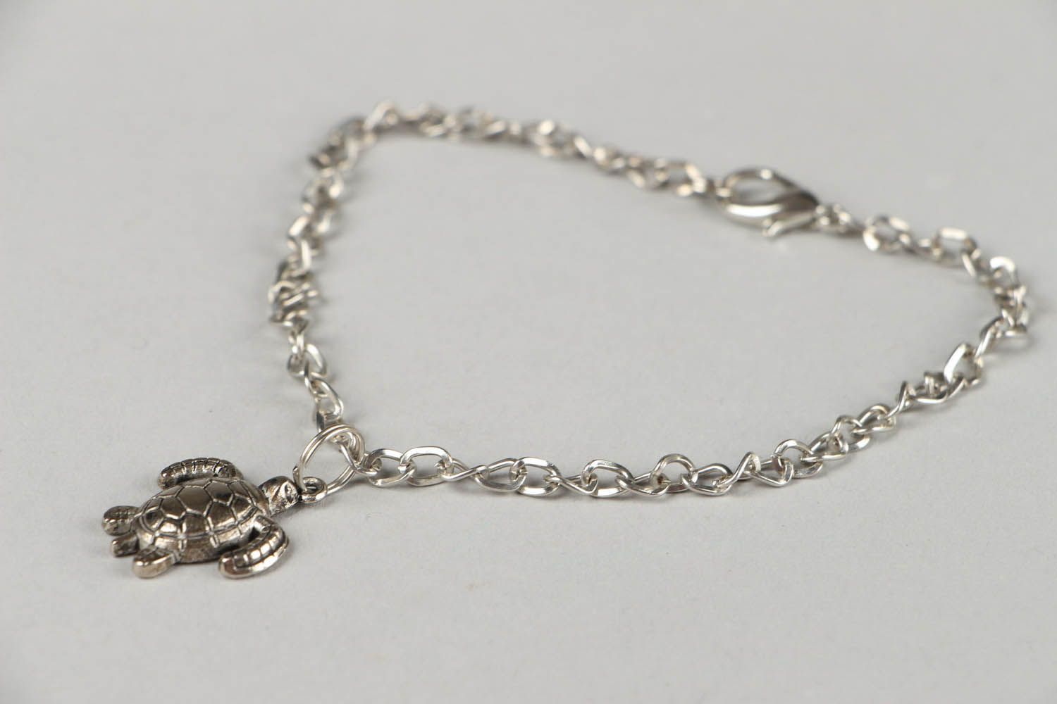Foot bracelet with a turtle photo 1