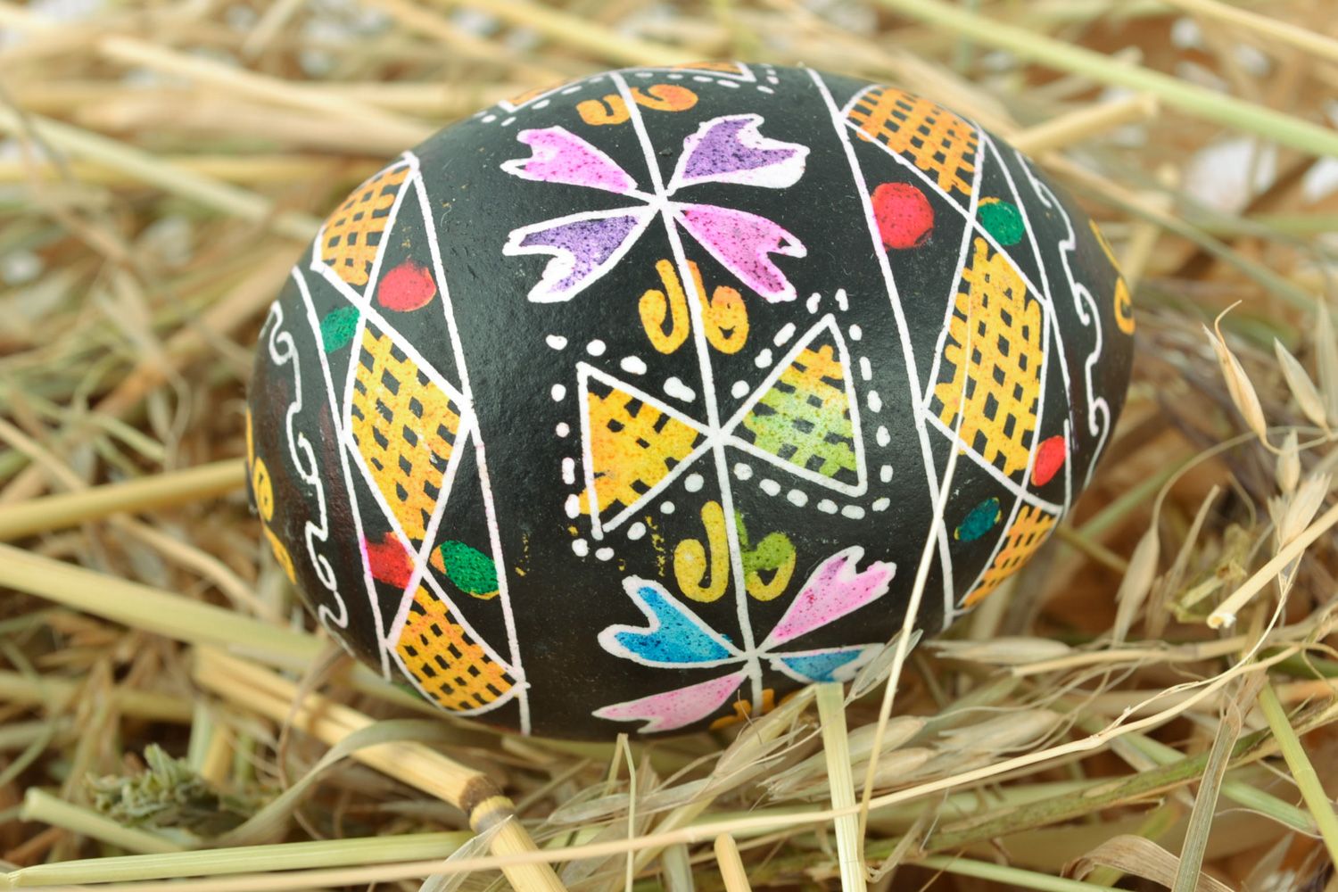 Beautiful colorful Easter egg with traditional painting made using wax technique photo 1