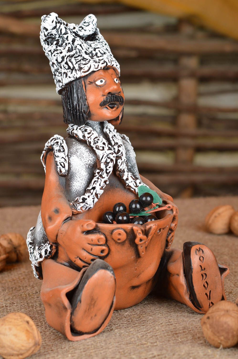 Figura de arcilla artesanal pequeña multocolor original con bolsillo hombre  foto 1