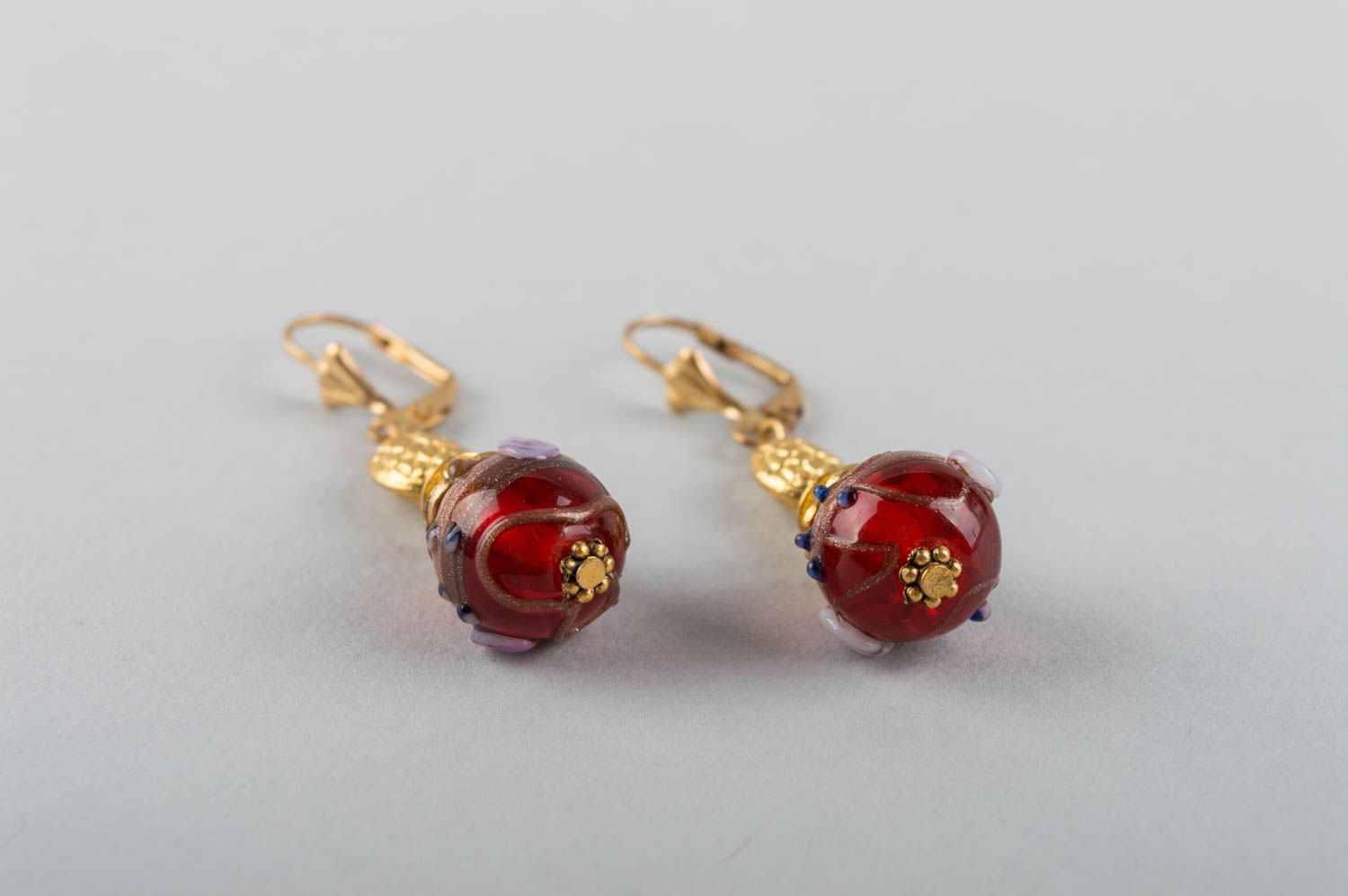 Handmade luxurious dangling earrings with golden colored basis and mural glass photo 3
