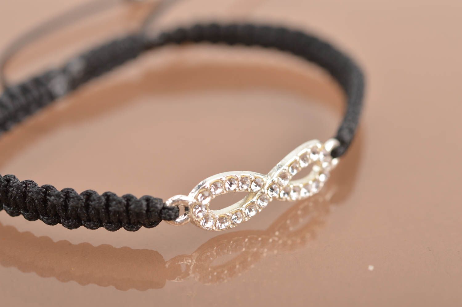 Handmade cute thin black woven wrist bracelet made of silk with insert photo 4
