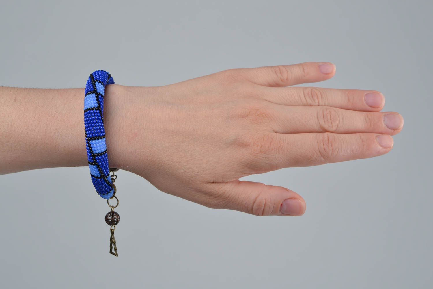 Handmade beautiful blue beaded cord bracelet with geometric paint photo 2