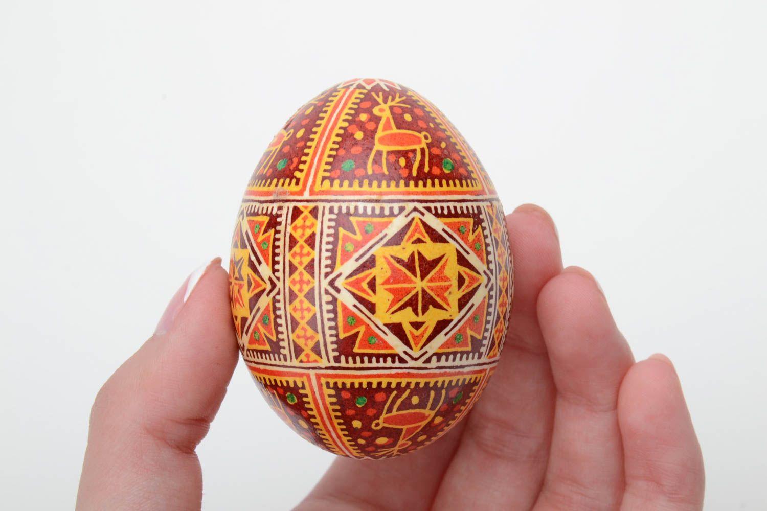 Homemade decorative souvenir Easter egg painted with hot wax and aniline dyes photo 5