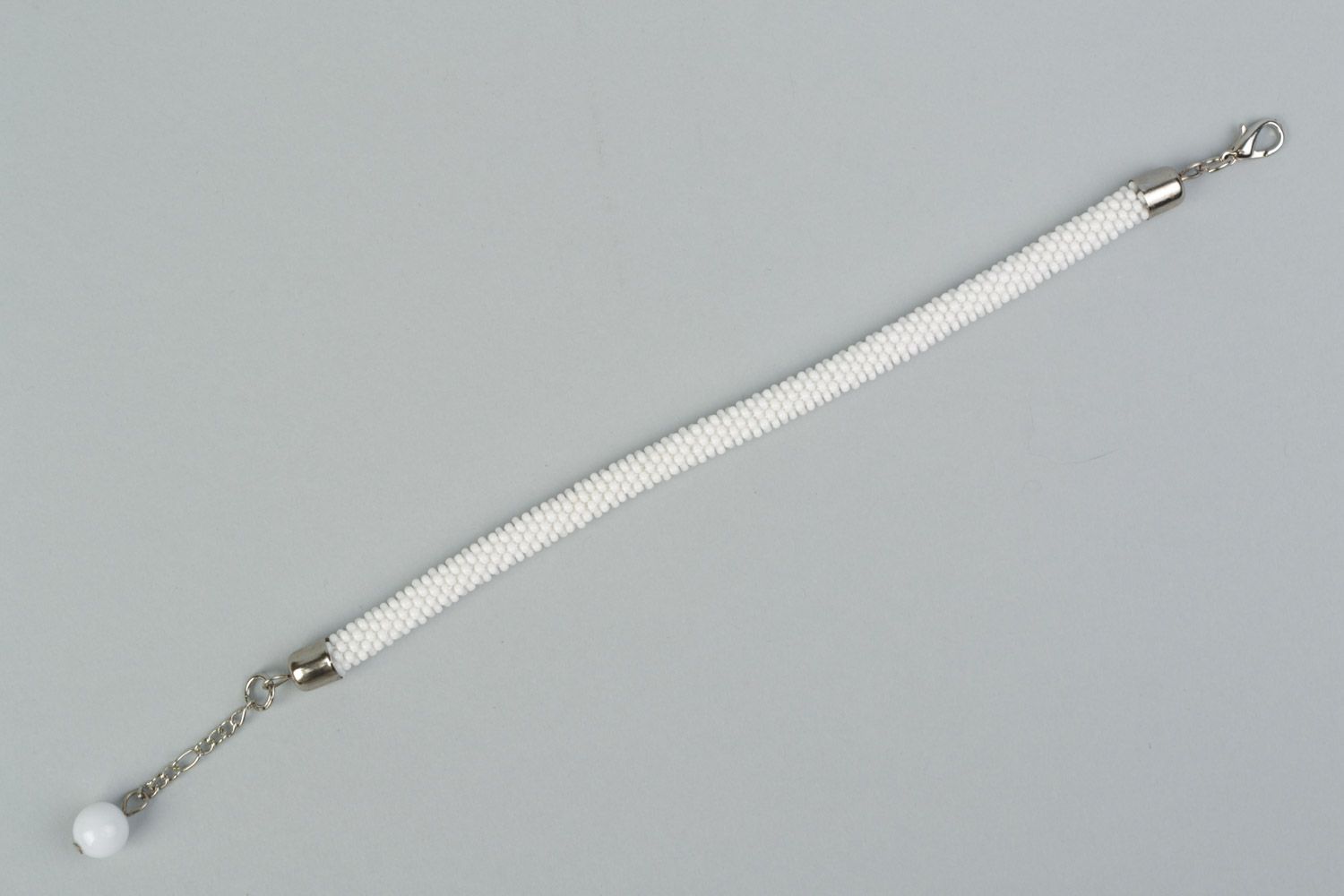 Handmade festive wrist cord bracelet crocheted of Czech beads in white color photo 5