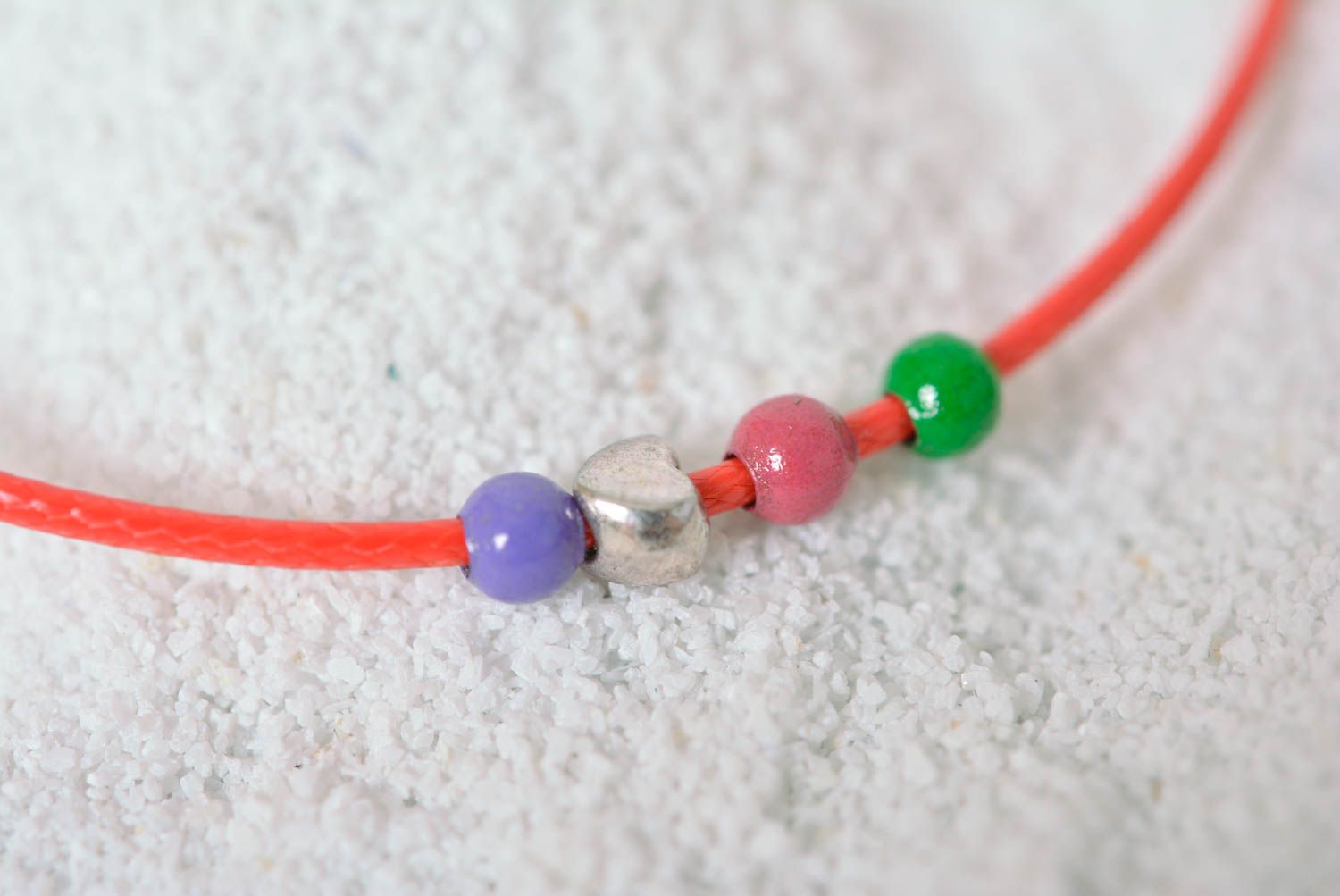 Handmade thin red bracelet cord with blue, green, blue, and silver beads photo 2