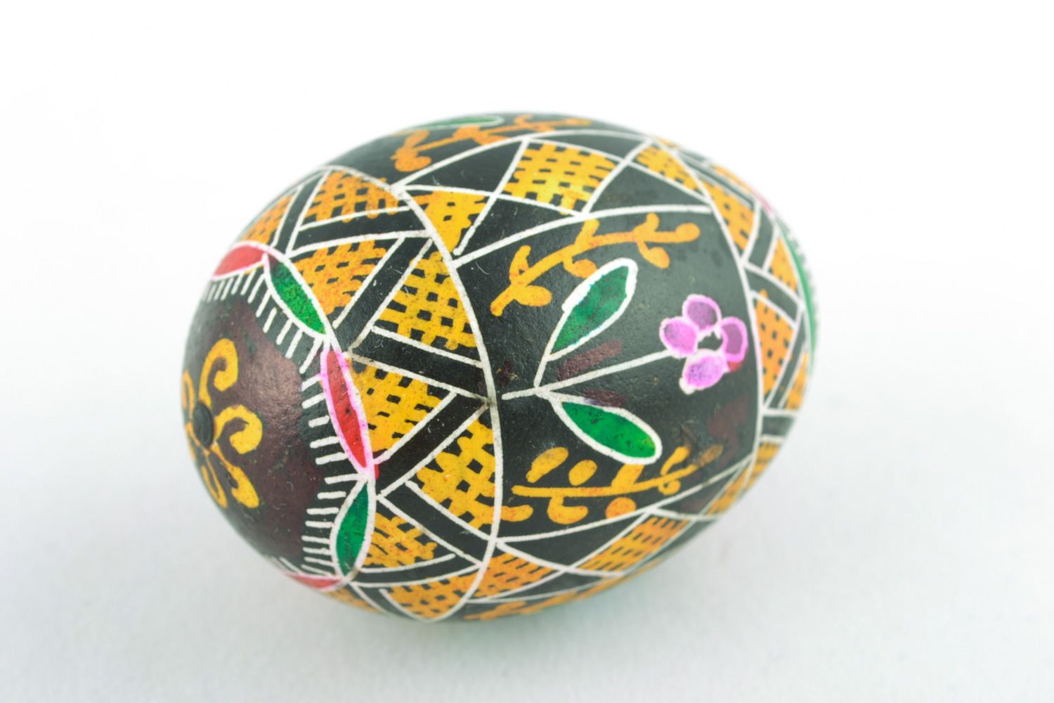 Colorful ornamented art Easter egg with handmade painting on black background photo 3