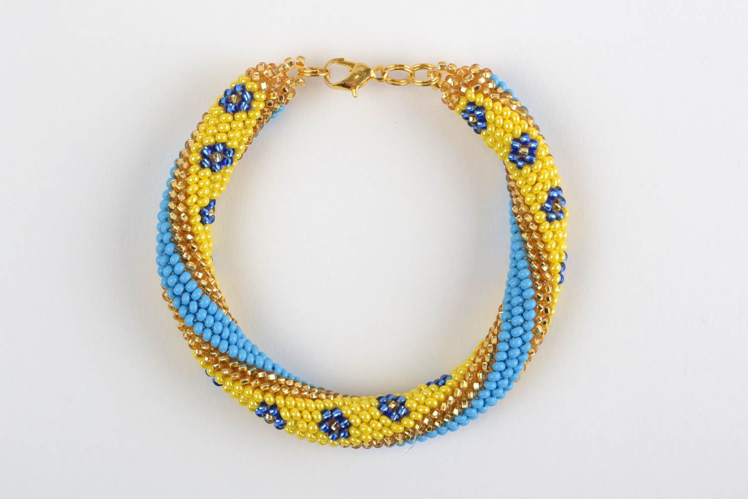 Наручный браслет из бисера ручной работы в виде жгута желтый с голубым фото 4