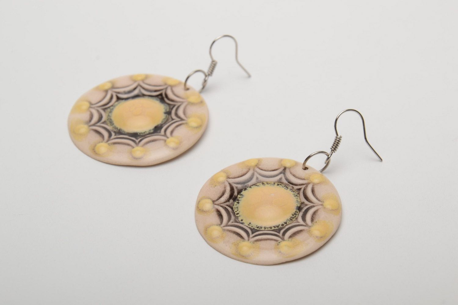 Handmade beige ceramic dangle earrings of round shape painted with enamels photo 3