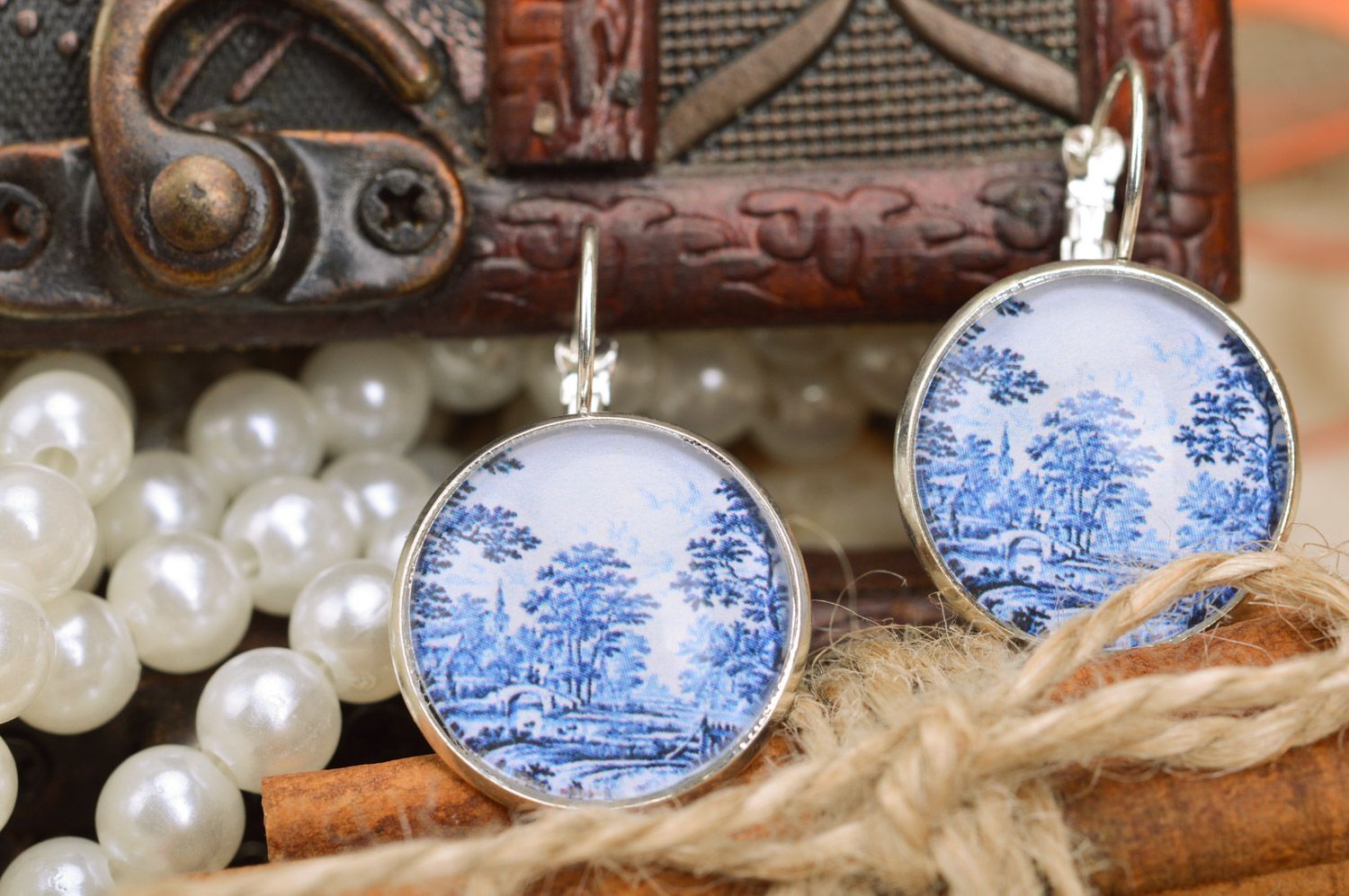 Handmade metal round dangle earrings with landscape print in white and blue colors photo 1