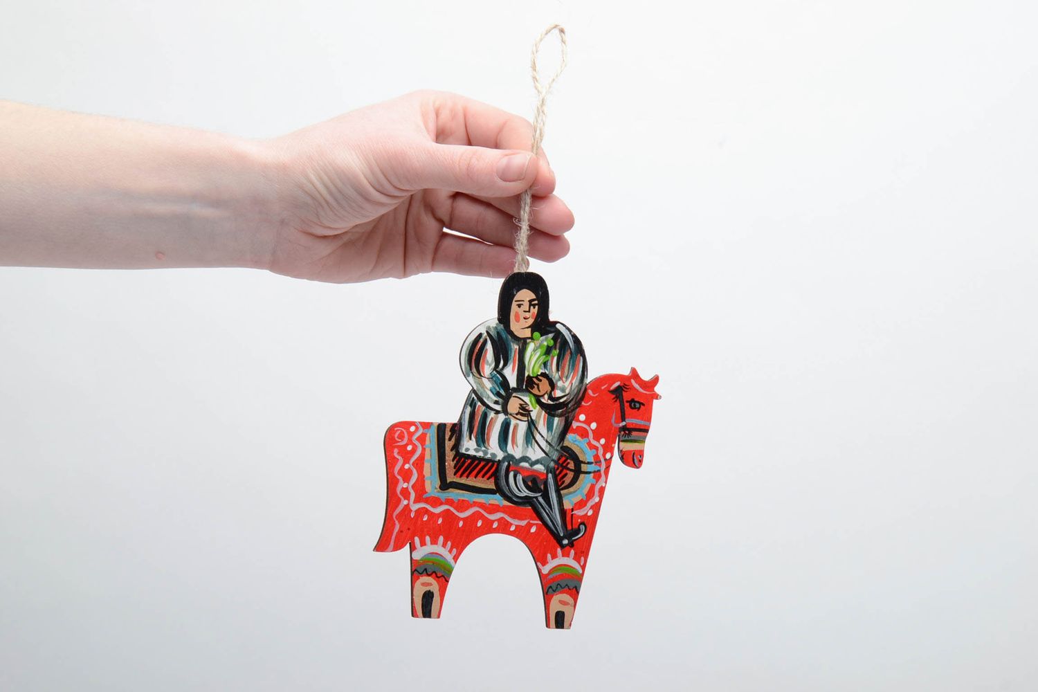 Wooden interior pendant in the shape of a guy riding a horse photo 2
