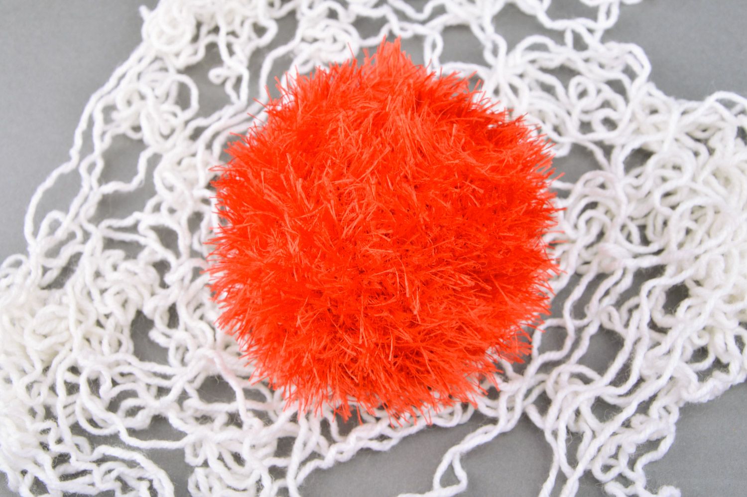 Handmade soft toy crocheted of red fluffy threads in the shape of ball for babies photo 5
