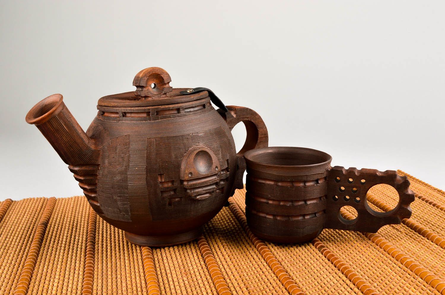 Decorative clay brown tea set of kettle and cup with handle photo 1