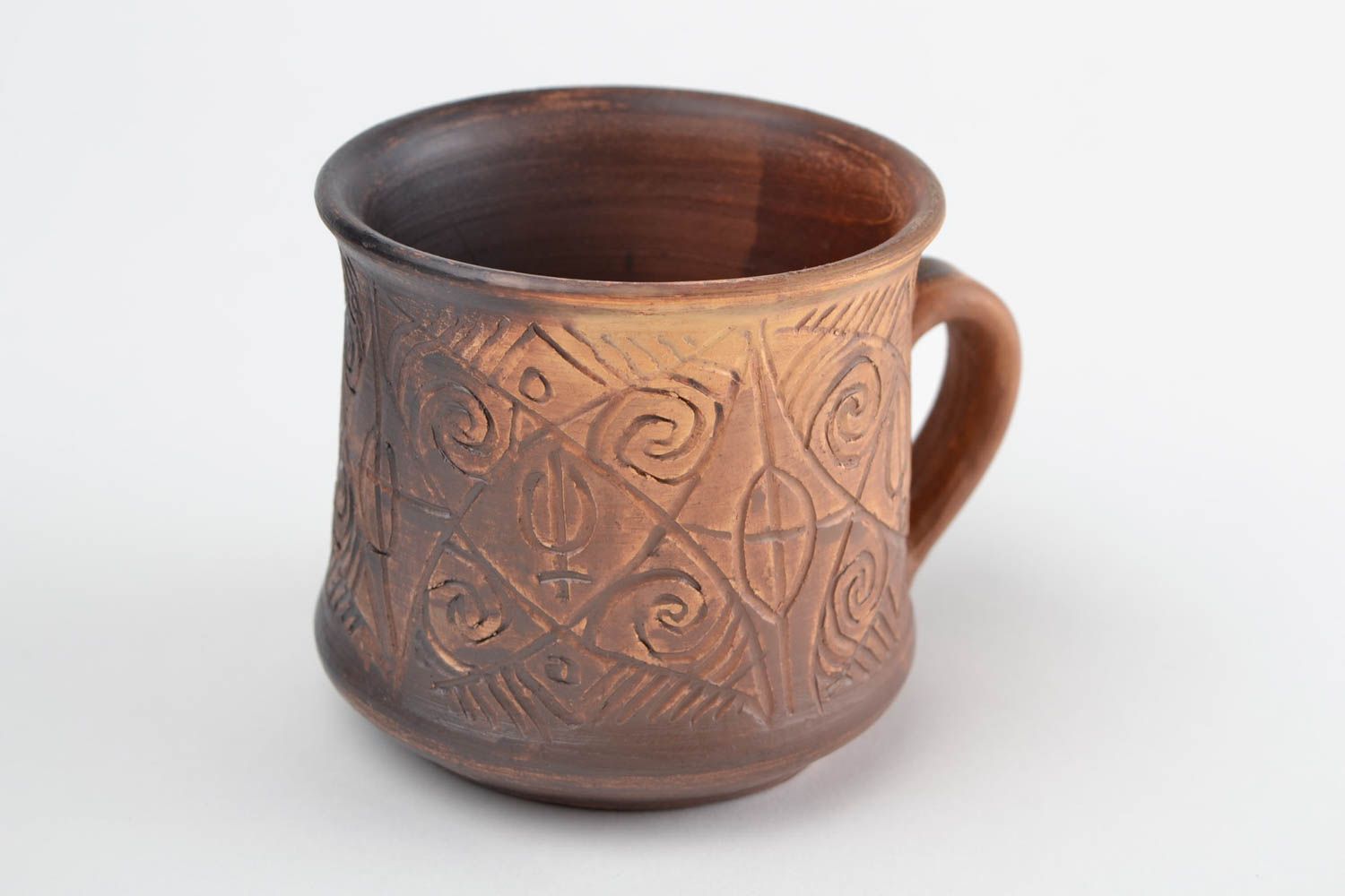 Clay cup for drinks in brown color with handle and cave symbols photo 5