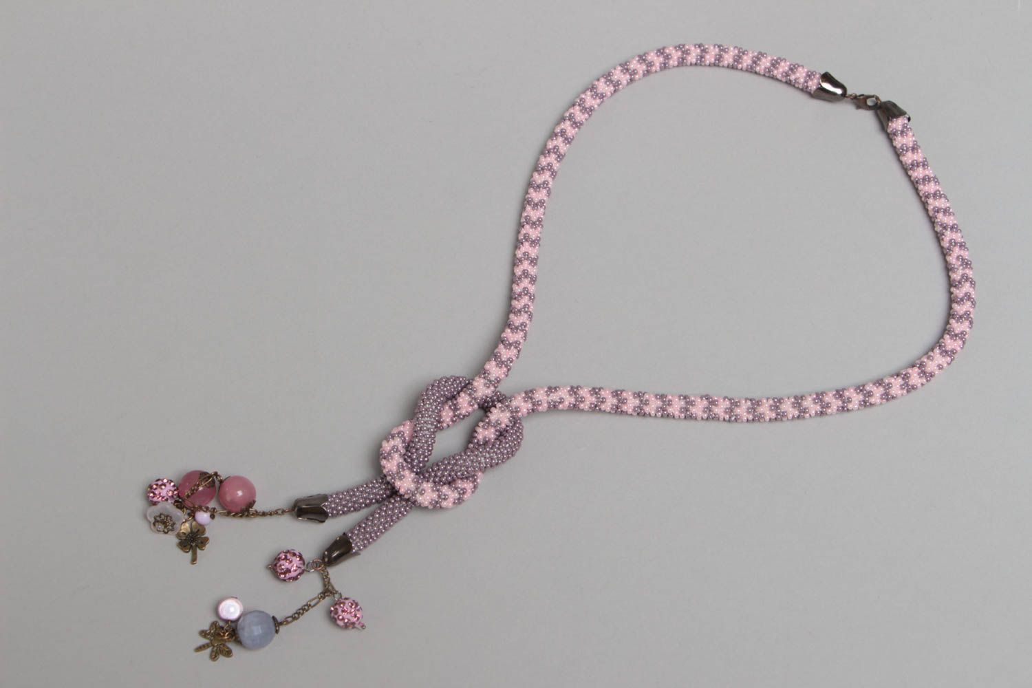 Handmade designer gray and pink beaded cord necklace with charms for women photo 2