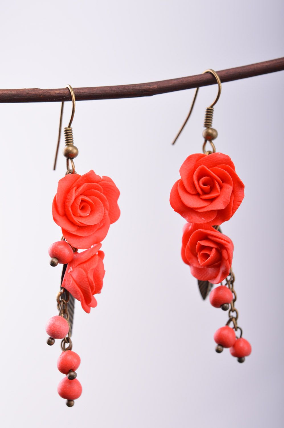 Handmade women's polymer clay flower earrings with charms in the shape of roses and beads photo 2